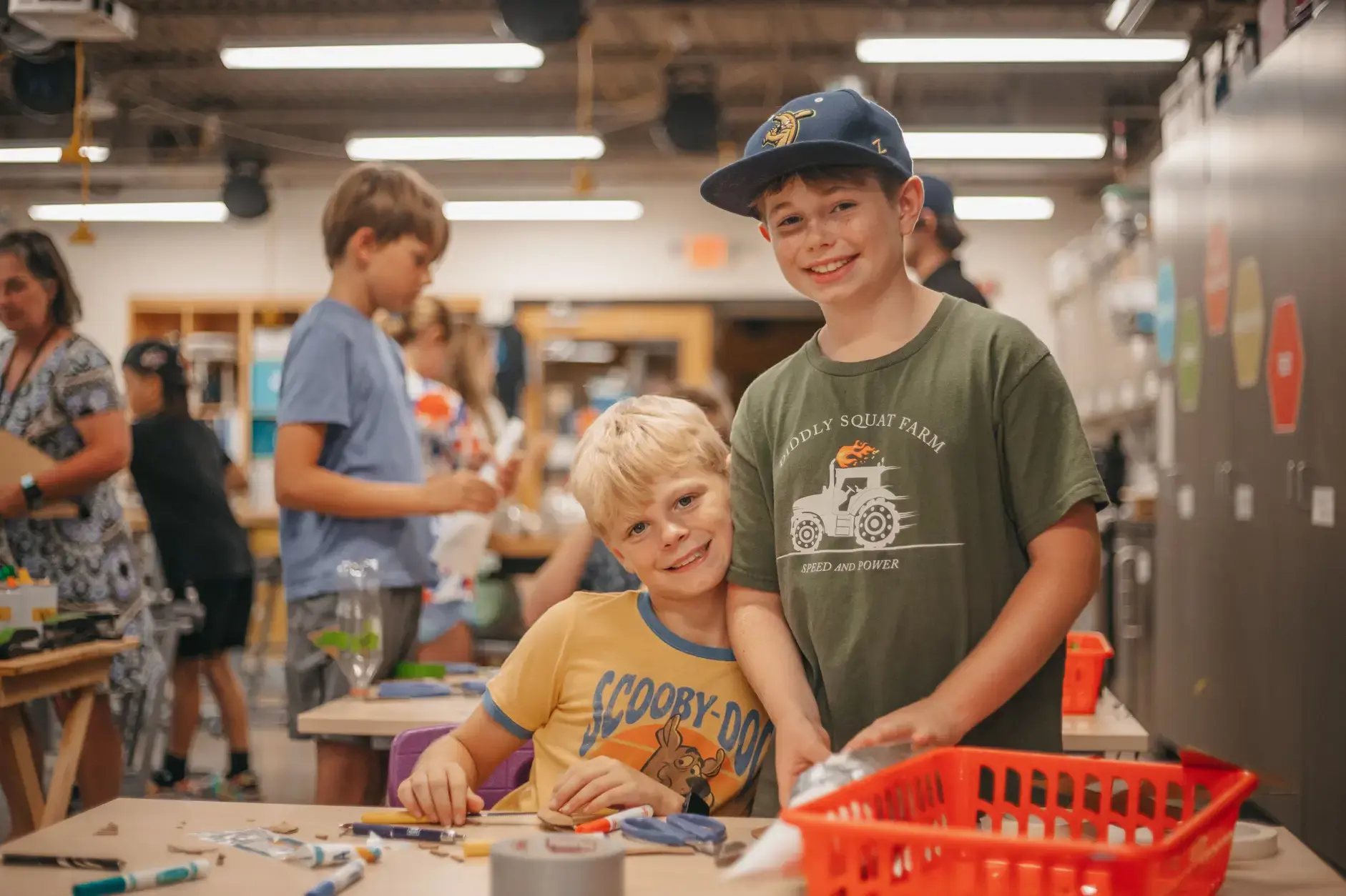 Lower school students collaborating on a classroom project