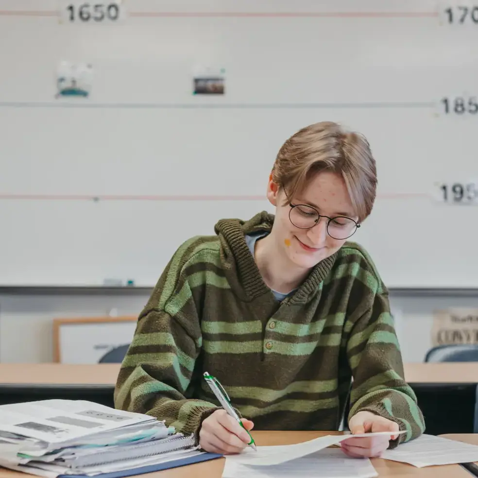 Upper school student completing coursework.