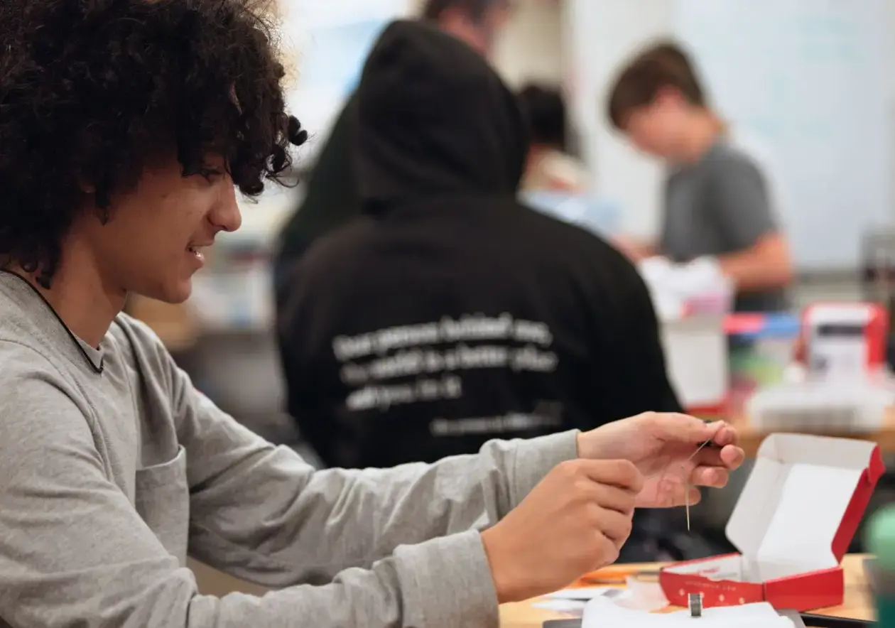 Student working on a hands-on design and technology project.
